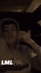 a blurry picture of a person 's face with the words lml written on the bottom .