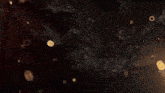 a pile of gold nuggets on a black background