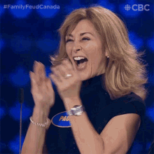 a woman with a name tag that says paul is clapping