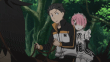 a man with the letter n on his jacket is riding a horse
