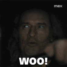 a close up of a man 's face with the words woo written on it .