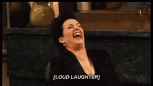 a woman is laughing with her mouth open and the words `` loud laughter '' written below her .