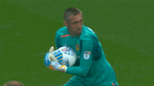 a soccer player wearing a green jersey that says pesa
