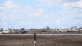 a fighter jet with the letter f on the tail is taking off from a runway