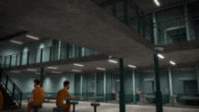 a cartoon character with a very large head is standing in a room with his arms outstretched