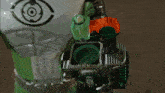 a person is holding a device with a green light coming out of the top