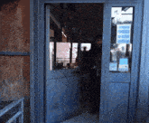 a man standing in a doorway with a sign on it that says ' a ' on it