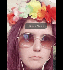 a woman wearing sunglasses and a flower crown with the name filiberta allegra on her face