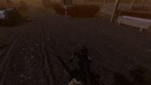 a person is holding a chainsaw in a dark room