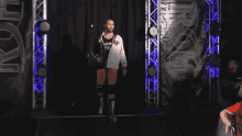 a wrestler wearing a black and white jacket that says echti pir on it