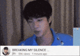 a man in a blue shirt is sitting in front of a computer screen with the caption breaking my silence ..