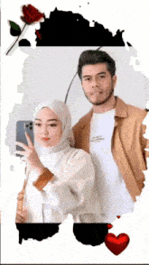 a man and a woman are posing for a picture and the woman is wearing a hijab