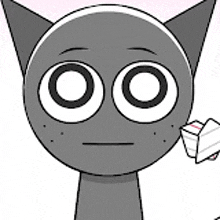 a close up of a cartoon cat holding a piece of paper in its mouth .