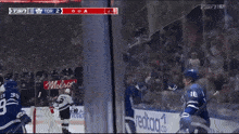 a hockey player wearing a number 91 jersey stands on the ice