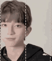 a close up of a young man 's face with a white line between the eyes .