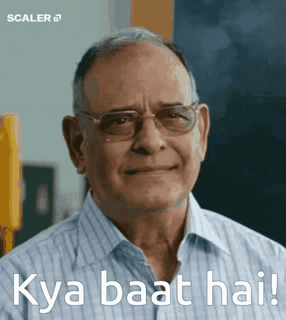 a man wearing glasses is smiling with the words kya baat hai written below him