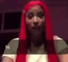 a woman with red hair is making a funny face while wearing a white shirt .