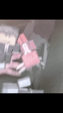 a person is typing on a keyboard with a red key that says ' s ' on it