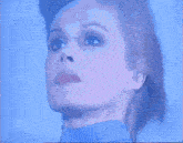 a close up of a woman 's face with her eyes closed