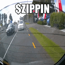 a car is driving down a street with a sign that says easy