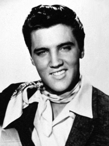 a black and white photo of elvis presley wearing a bandana around his neck