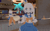 a girl in a sailor outfit is holding a spear