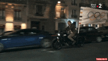 a blurred image of a street with the number 2 on the bottom