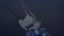 a woman is laying on the ground with a gun in her hand