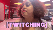 a woman with curly hair says twitching in pink