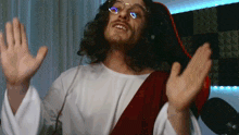 a man in a jesus costume with glasses and headphones