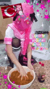 a person in a pink costume is mixing something in a bowl .
