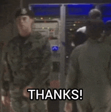 a group of soldiers are standing in a room with the words thanks on the screen
