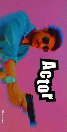 a man is holding a gun in front of a pink background with the word actor on it