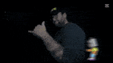a man wearing a hive hat stands in front of a sign that says nappy boy radio
