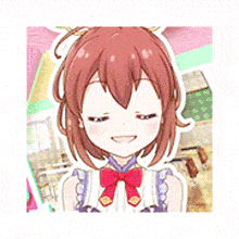 a close up of a cartoon girl with brown hair and a red bow .