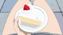 a girl in a red jacket is holding a cake in her hand