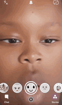 a close up of a person 's face with a smiley face in the center