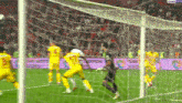a soccer game is being played in front of a banner that says bein sport