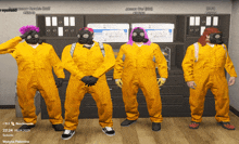 a group of people wearing yellow jumpsuits and gas masks are standing next to each other