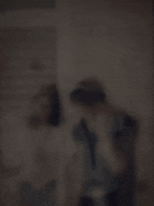 a blurred image with the words ' cause we 're living in a world of fools ' on it