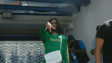 a man in a green shirt that says chrome