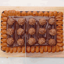a chocolate cake with nuts and caramel on top