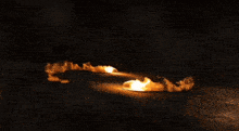 a large explosion with the letter t visible in the center