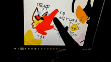 a computer screen shows a drawing of a cat with the word cat on the bottom