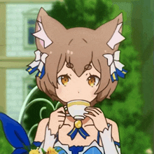 a girl with a cat 's ears is drinking a cup of tea