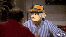 a gif of a man with a monkey face on his head