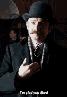 a man in a suit and bowler hat says " i 'm glad you liked "