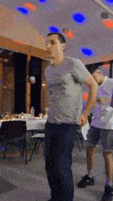 a man wearing a shirt that says california on it is dancing