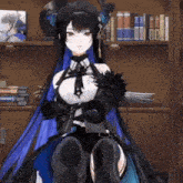 a girl in a black and blue dress is sitting in front of a bookshelf