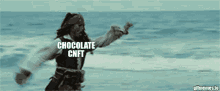 a man in a pirate costume is dancing in the ocean with the words chocolate cnft written above him